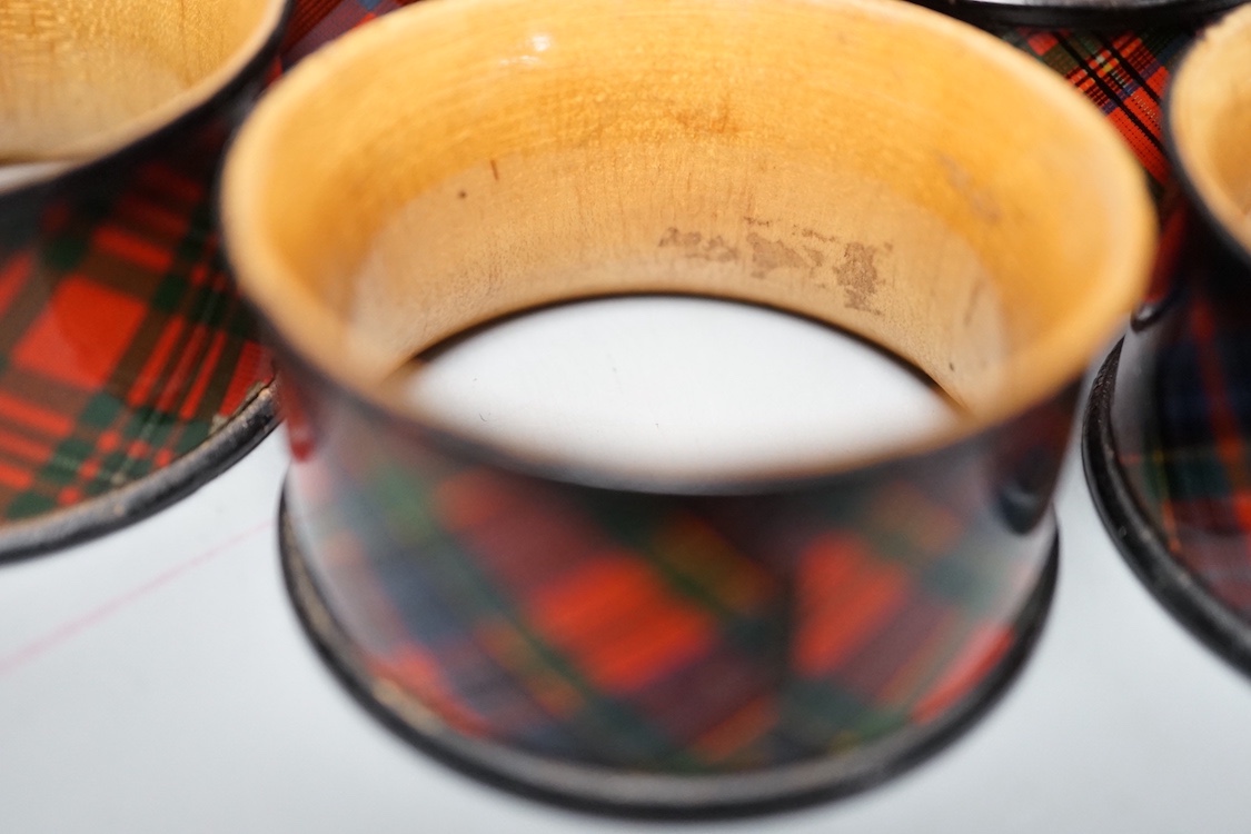 A German papier mache spectacles case and five Tartan ware napkin rings